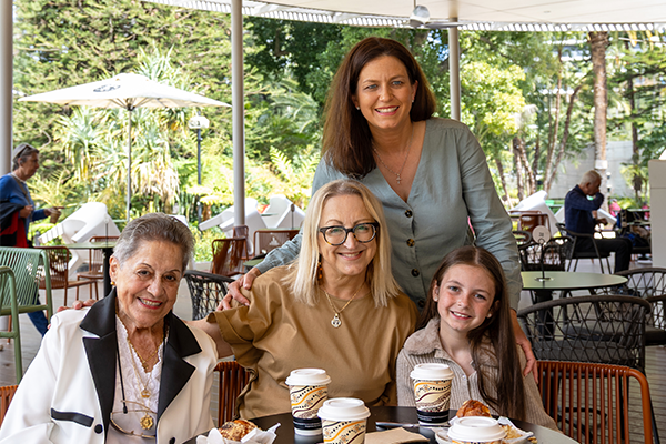 Family enjoying coffee and snacks at the cafe