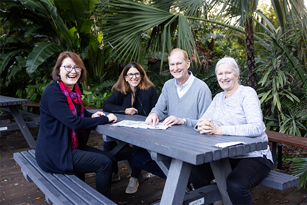 Zoo visitors sitting at a picnic table