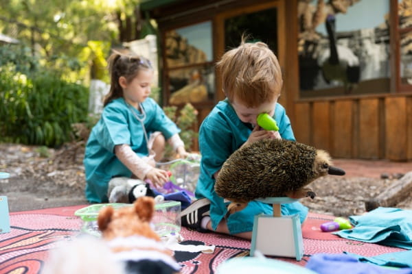 Two kids participating in program